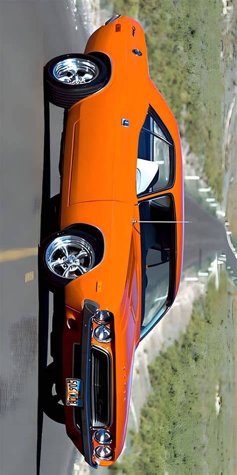 An Orange Sports Car Driving Down The Road