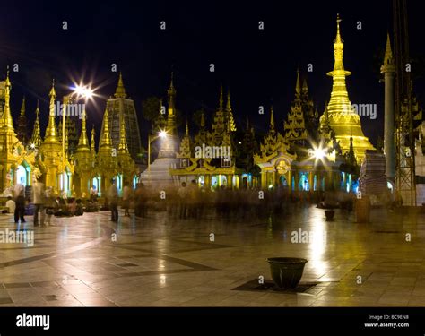 The Illuminated Golden Spires And Temples Of The Shwedagon Pagoda In