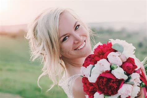 Beautiful Happy Blonde Woman In White Dress Smiling In Sun Light Glow