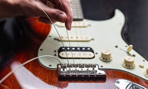 How To Effectively Restring Your Guitar Are You Doing It Wrong