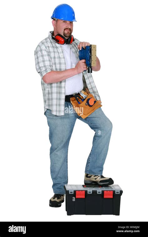 Man using power sander Stock Photo - Alamy