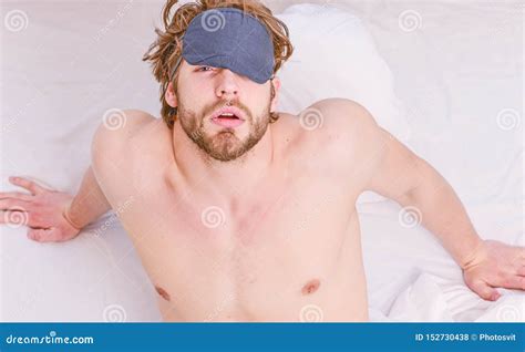 Close Up Of Feet In A Bed Under White Blanket Stretch After Wake Up In