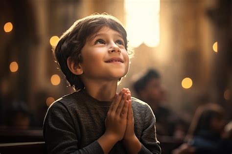 Premium Photo Cute Small Latin Boy Praying In The Church And Jesus