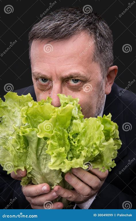 Man Holding And Eating Lettuce Stock Image Image Of Fresh Male 30049099