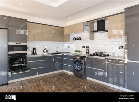 Luxury modern white, beige and grey kitchen interior Stock Photo - Alamy