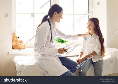 Friendly Doctor Talking Child Touching Her Stock Photo 2060569700 ...