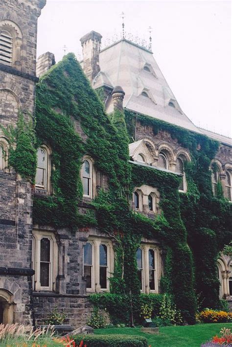 An Old Building With Ivy Growing All Over It