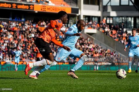 Bamba DIENG of FC Lorient and Mohamed YOUSSOUF of AC Ajaccio during ...