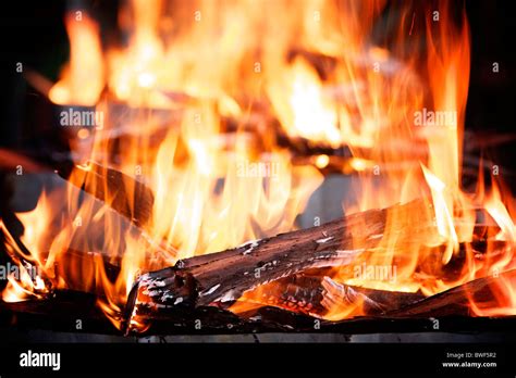 Flames Shoot Upwards From A Raging Outdoor Log Fire Stock Photo Alamy