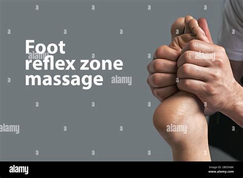 Male Masseur Hands Doing Reflexology Massage On Female Foot Reflex Zones In The Spa Salon Copy