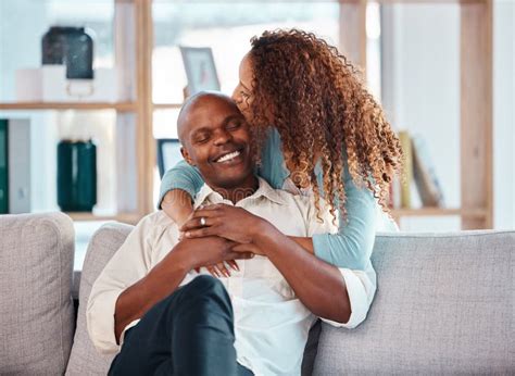 Love Happy And Couple Kiss On Sofa For Bonding Quality Time And