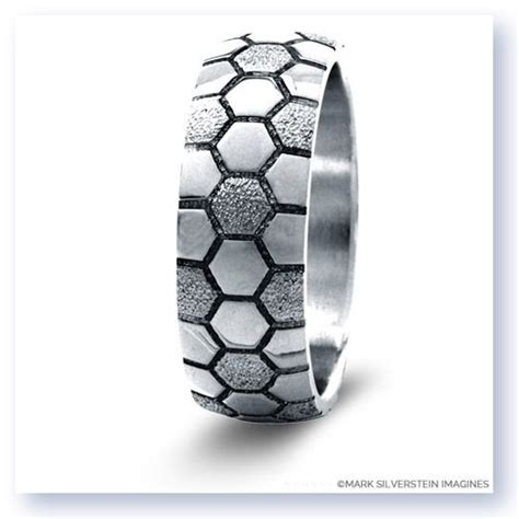 A Wedding Ring Made Out Of Silver And Black Diamonds With An Intricate