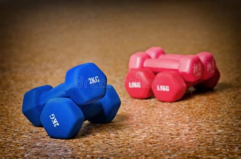 Colored dumbbells stock image. Image of fitness, floor - 37084435