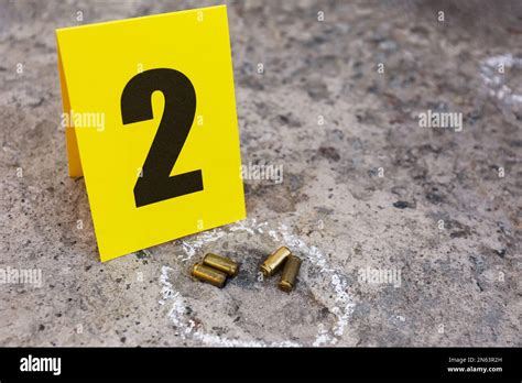 Crime Scene With Bullet Shells And Evidence Mark On Floor Detective