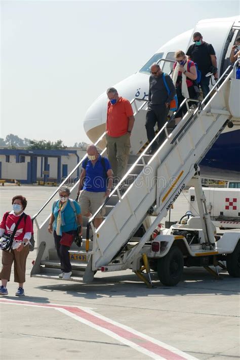 Passengers Wear Masks To Protect From The Corona Virus Editorial Photo