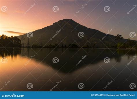 Sunrise with Mount Sumbing with Lake Surface on the Foreground Stock Image - Image of surface ...