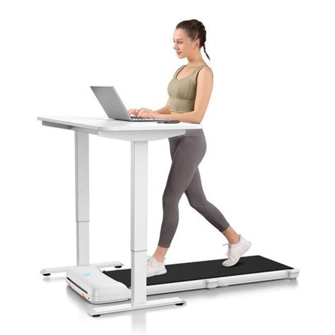 A Woman Using A Laptop Computer On A Treadmill