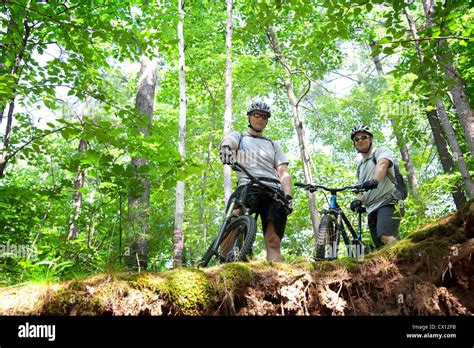 Two Mountain Bikers On Ledge Stock Photo Alamy