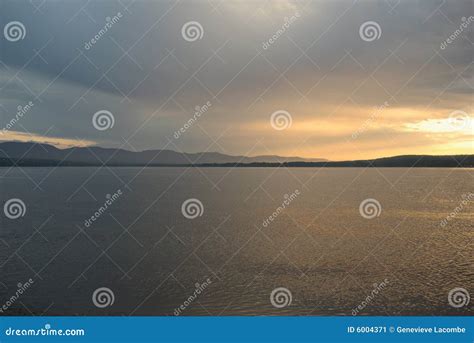 Gray sunset stock image. Image of yellow, mountain, clouds - 6004371