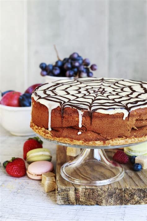 Halloween Chocolate Spider Web Cake And Various Fruits Around Stock