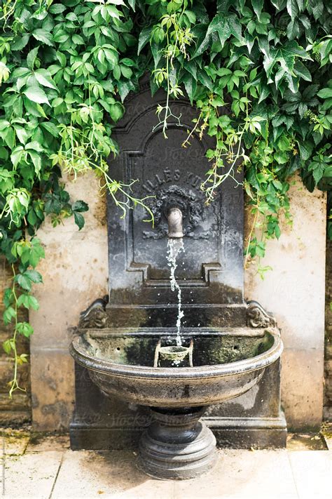 "Small Fountain in Wall" by Stocksy Contributor "Dreamwood Photography " - Stocksy