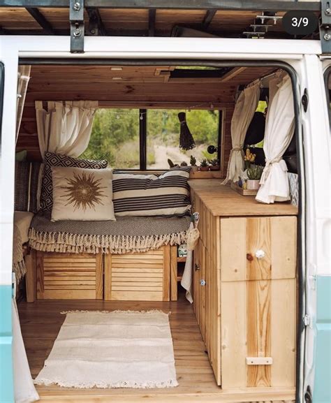 The Interior Of A Camper Van With Its Bed Pulled Up To It S Side