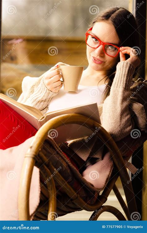 Woman Sitting On Chair Reading Book At Home Stock Image Image Of Calm