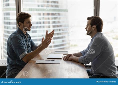 Two Businessmen Business Partners Meeting In Office For Negotiation