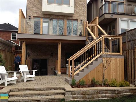 Pvc Deck With Glass Railings And Walkout Basement Toronto Landscaping And Deck Building Company