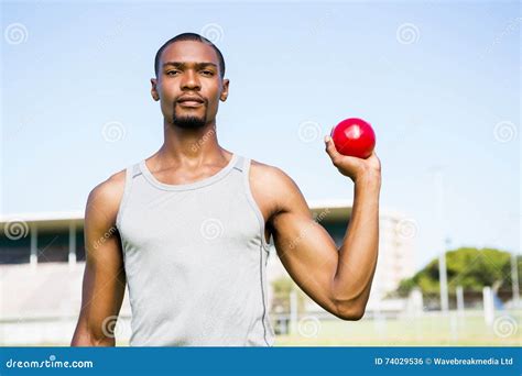 Male Athlete Holding Shot Put Ball Stock Photo Image Of Concentration