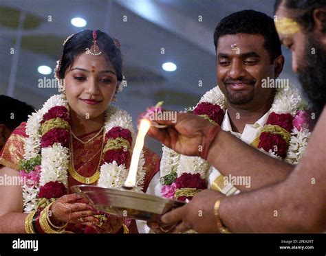 Sri Lankan cricketer Muttaiah Muralitharan, second right, and his wife ...