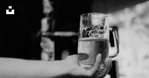 A Person Holding A Beer Glass In Their Hand Photo Free Glass Image On Unsplash