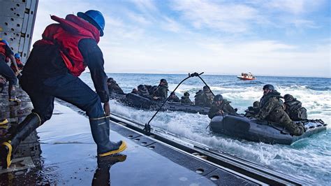 Sailors And Marines Conduct Combat Rubber Raiding Craft Training Aboard