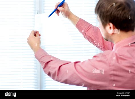 Male Writing Something On Transparent Paper With Marker Stock Photo Alamy