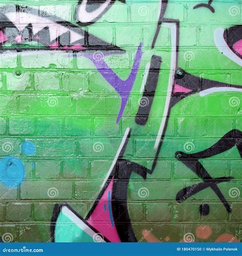 Abstract Colorful Fragment Of Graffiti Paintings On Old Brick Wall In