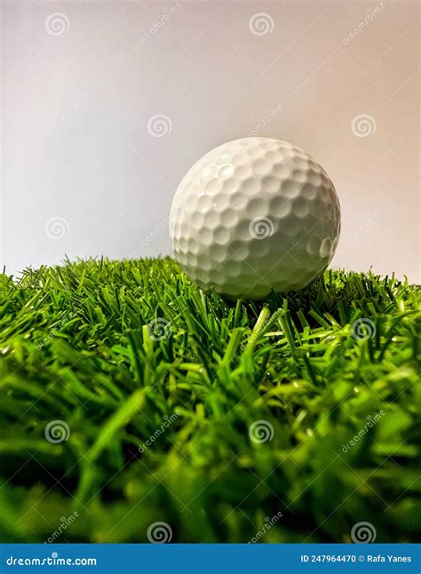 Macro of White Golf Ball on Green Artificial Grass Stock Photo - Image ...