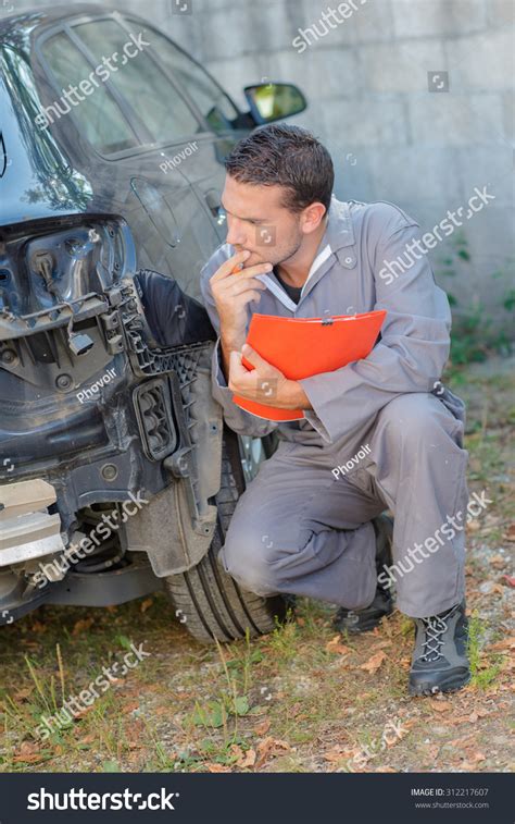 Mechanic Assessing Car Stock Photo Shutterstock