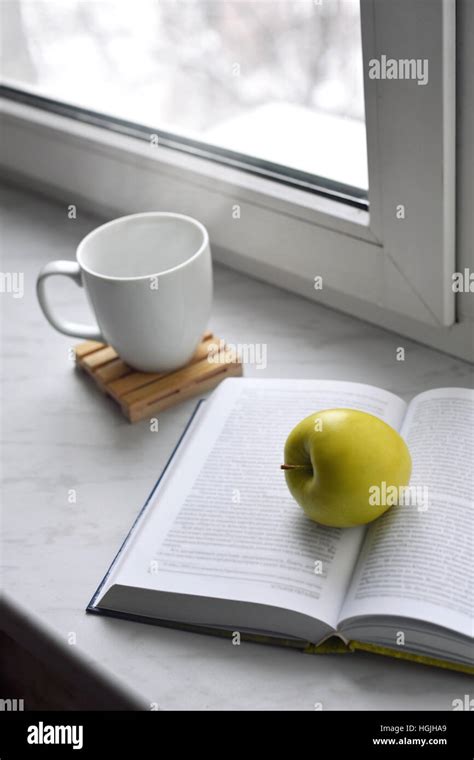 Cozy Home Still Life Cup Of Hot Coffee And Opened Book With Green