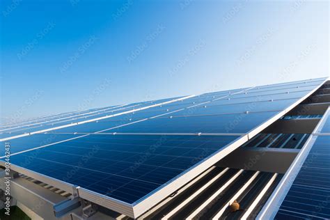 Solar panels and blue sky background.Solar cells farm on the roof ...