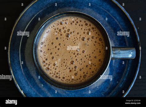 Blue Cup Of Coffee On Black Background For Design Purpose Stock Photo