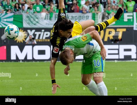 Wolfsburg S Jakub Baszczykowski Bottom And Dortmund S Marc Bartra