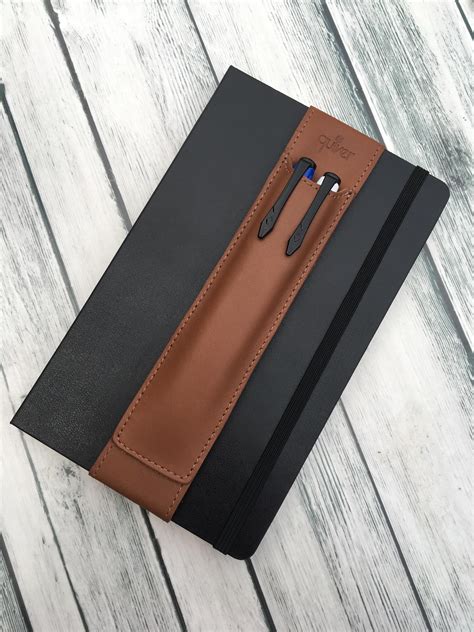 The Design And Brand Name Of This Leather Notebook Pen Holder By Quiver