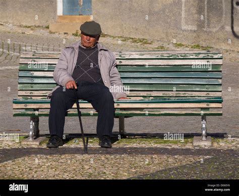 Old Man Sitting On Park Bench