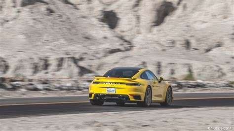 Porsche 911 Turbo | 2021MY (Color: Racing Yellow; US-Spec) | Rear Three-Quarter