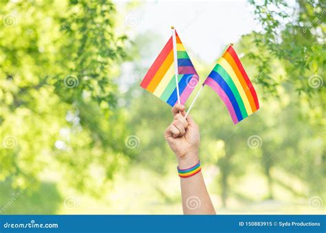 Hand With Gay Pride Rainbow Flags And Wristband Stock Image Image Of