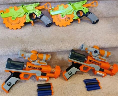 Nerf Gun Lot Of 4 2 Zombie Strike Crosscut Blaster Buzz 2 Clear Shot Dart Gun Ebay