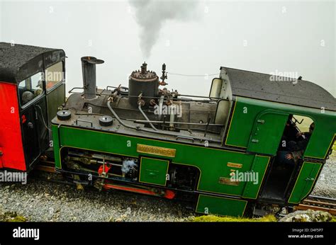 Snowdon Mountain Railway train just below the summit of Snowdon (Yr Wyddfa) Snowdonia North ...