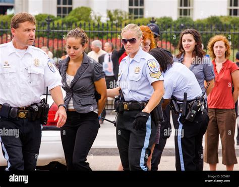 A young female protester is handcuffed and detained for protesting in ...