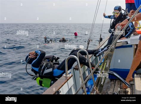 Scuba Diver In Boat Doing Back Roll Entry Tamariu Costa Brava Spain