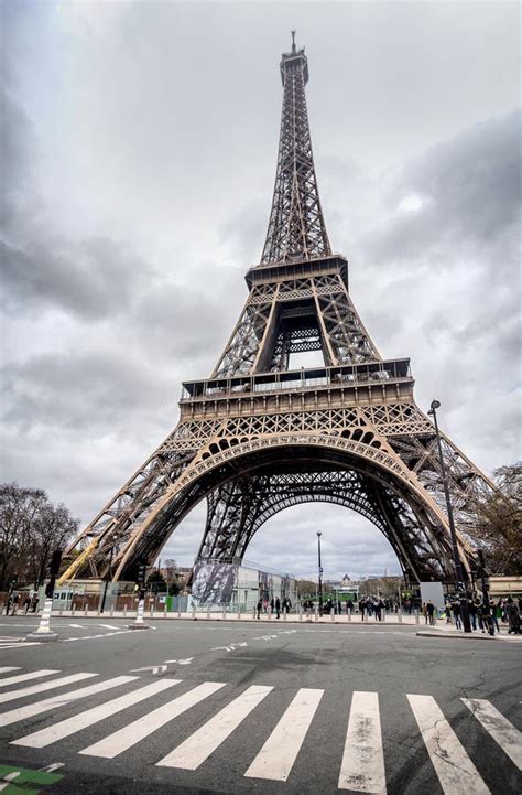 The Eiffel Tower With Gray Sky And Clouds In Paris France Editorial